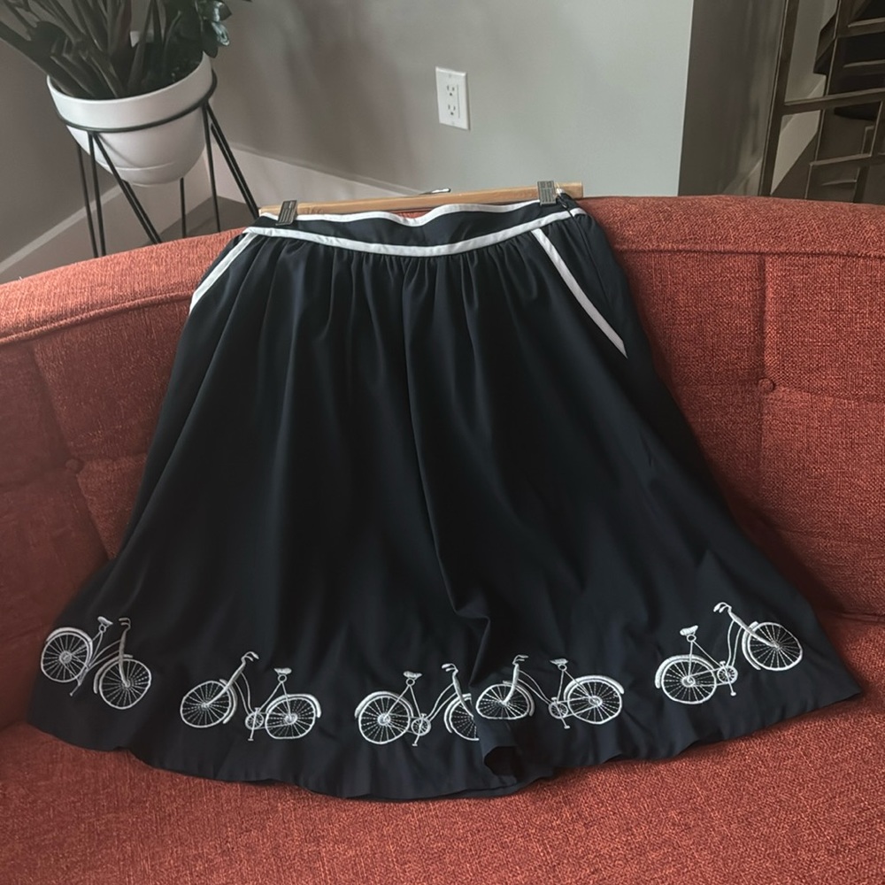 Anthro Comme Toi skirt with embroidered bicycle embellishments.